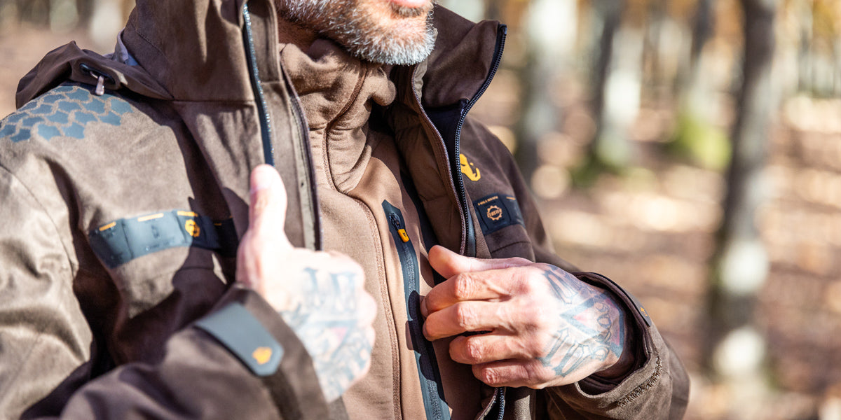 how international hunters layer clothing: breathable moisture-wicking merino base layers, mid layers, jackets