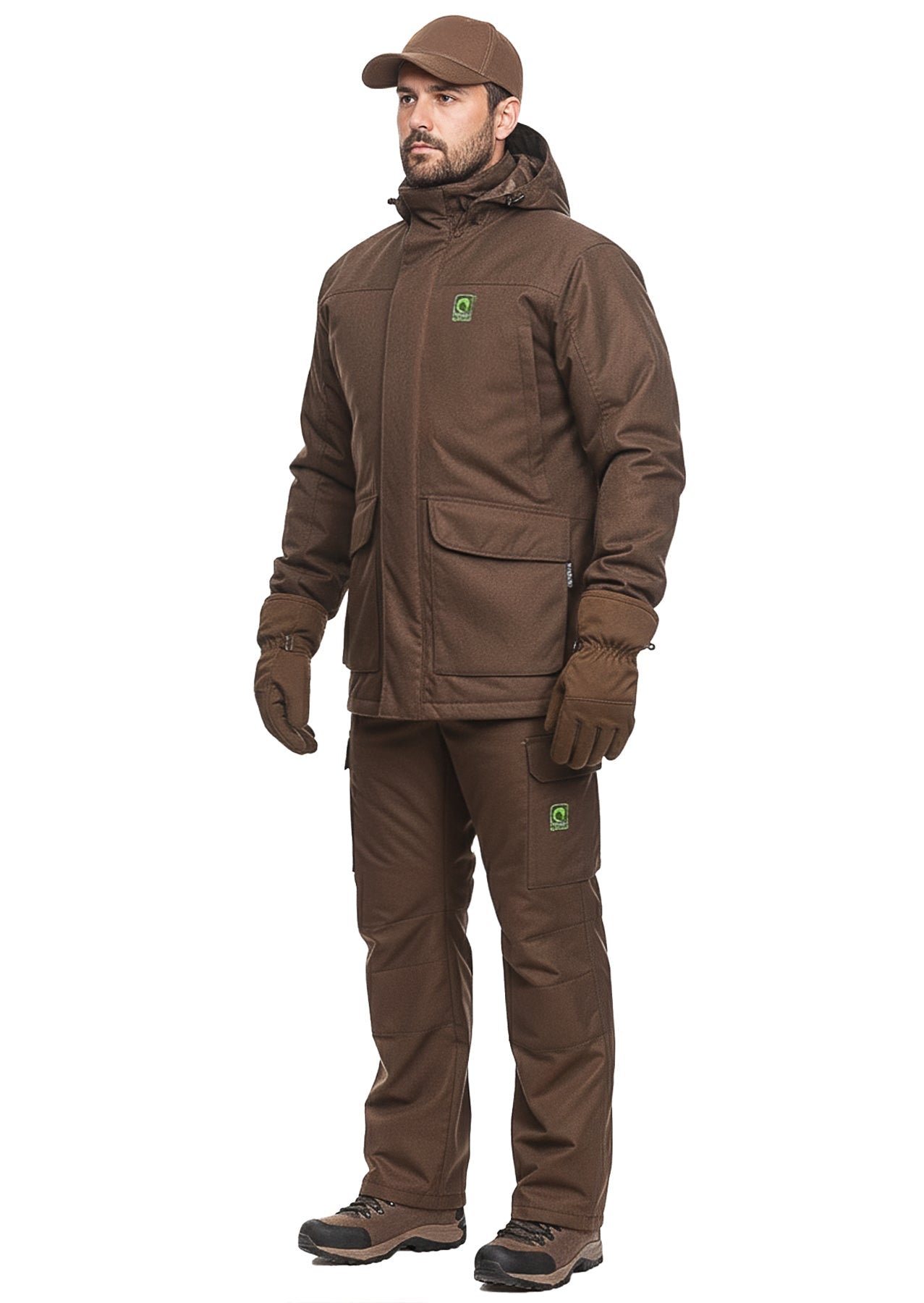 Male model demonstrating a complete brown winter hunting suit, comprising an insulated jacket with a raised hood, matching cargo pants, peaked cap, and thermal gloves.