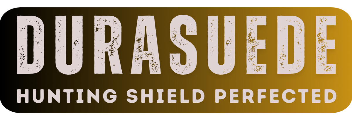 Text DURASUEDE in large, distressed white letters on a gradient background from dark brown to light brown. Below, in smaller white text, it reads HUNTING SHIELD PERFECTED by HILLMAN, emphasizing the excellence of their womens hunting gear.